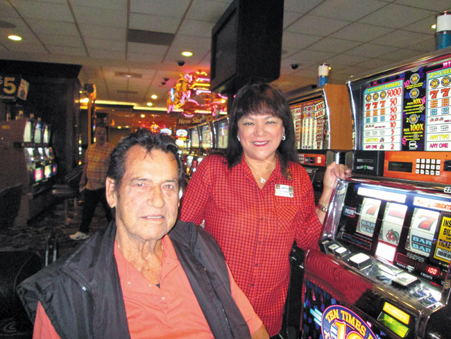 William Payle poses with Liz Damon after his $6,000 win at the Fremont. Photo courtesy Boyd Gaming
