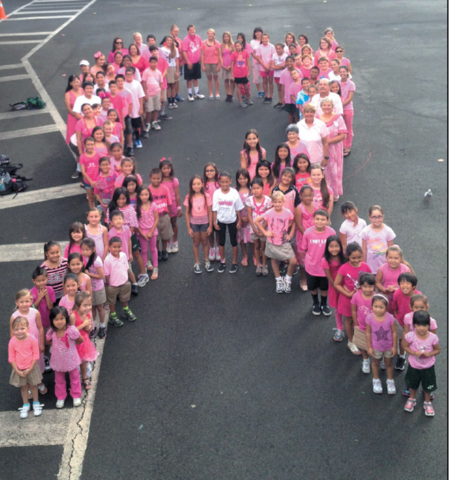 In celebration of Breast Cancer Awareness month, St. John Vianney School students participated in a 'pink-out' day Oct. 25. As a breast cancer survivor herself, principal Caryn DeMello said that day was especially meaningful to her. Photo by Gordon Horiuchi.