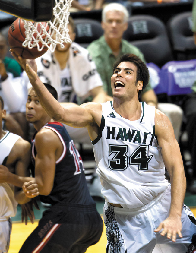 Hawaii forward Christian Standhardinger (34) shoots a layup against St. Mary's in the Diamond Head Classic Dec. 23. Hawaii beat Saint Mary's 76-74 | AP Photo, Eugene Tanner