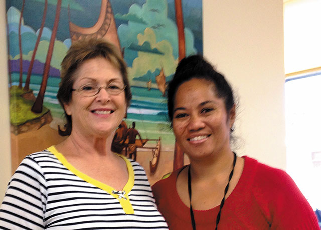 Health aide Margaret Iloa (left) and chief operations officer Oreta Tupola at the health center's reception area. Photo from Jorene Barut.