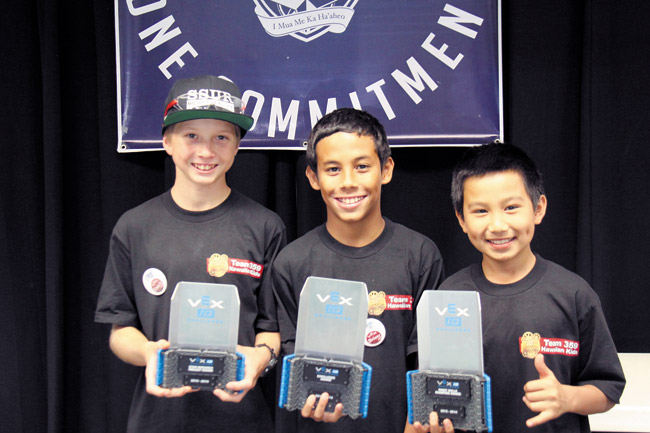 Waialua students Sonny Ciaruffoli, Chai Caplili and Zane Balmoja show off their VEX robotics trophies. Photo from Megan Andrada.