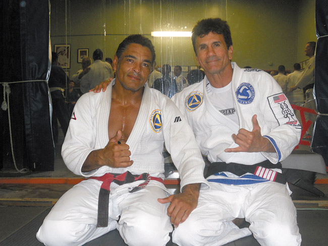 Romolo Barros (right), founder of the Hawaii Triple Crown of Brazilian Jiu Jitsu, with his mentor Rickson Gracie. The Hawaii Triple Crown of Brazilian Jiu Jitsu will have its first event of the series, the Hawaiian Open Championship, May 3 at Pearl City High School | Photo courtesy Romolo Barros