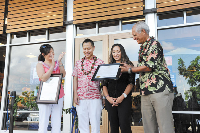 State Sen. Mike Gabbard (far right) and Rep. Sharon Har (far left) present certificates May 23 from the state Legislature to honor the new Pier 1 Imports store in Kapolei Commons shopping center. Also present are Pier 1 Imports regional manager Jeffrey Trinh and Kapolei store manager Leia Naehu. Photo from Sen. Gabbard.