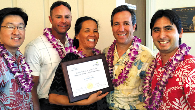 The team of (from left) Keith Sakuda, Eric Martinson, Ilima Ho-Lastimosa and David Walfish (far right) with Richard Wacker (second from right) of American Savings Bank, which sponsored the competition. Photo from Keith Sakuda.