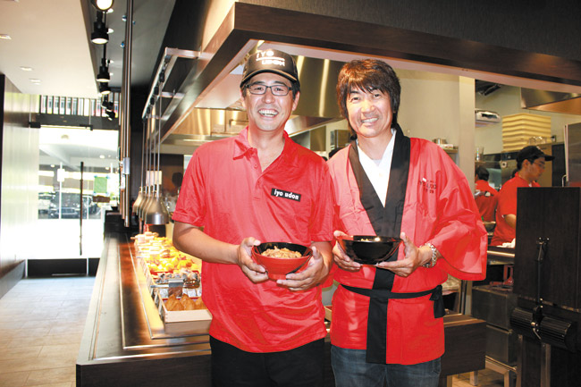 Iyo Udon general manager Kazu Michimoto and executive director Masayuki Hamaya celebrate the opening of the Ala Moana Center eatery during a private event June 14. The restaurant is located on the second floor, mauka, ewa wing.
