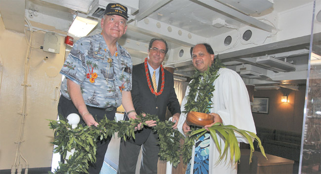 Sandy Gaston (left), longtime supporter of Battleship Missouri Memorial; Michael Carr, president and CEO of USS Missouri Memorial Association; and Kahu Kordell Kekoa participated in a Sept. 2 blessing and the untying of a maile lei, and welcomed guests into the newly restored Wardroom. Photo by Hi Shotz Photography.