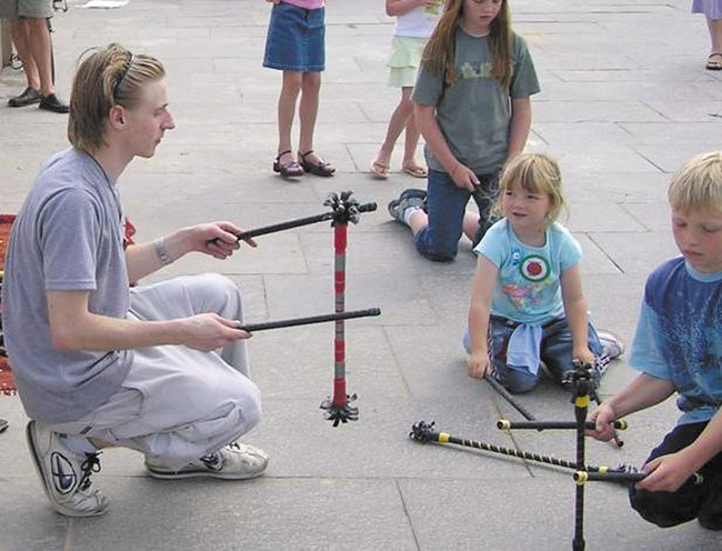 Playing with flower sticks PHOTO COURTESY ANNA LAU-PARISH