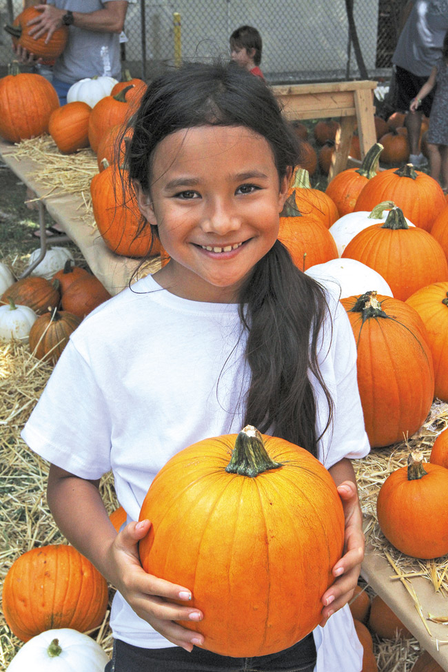 A happy harverster in the pumpkin patch. PHOTO COURTESY HOLY NATIVITY SCHOOL