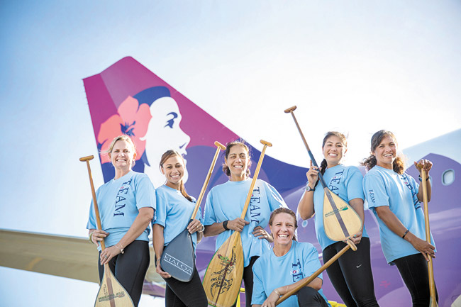 Hawaiian Airlines paddlers: (from left) San Diego customer service agent Lisa Kopacz, flight attendant Celeste Paiaina, ramp agent Pauahi Ioane, corporate recruiter Jennifer Polcer (kneeling), and flight attendants Allison Sokei and Moea DeFries PHOTO COURTESY NICKY LEONG