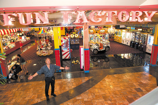 Warren Asing at the entrance to the ‘indoor carnival' in Windward Mall. Since 2003, Fun Factory has awarded nearly $100,000 in scholarships to 75 Native Hawaiian students who want to pursue a career in entrepreneurship