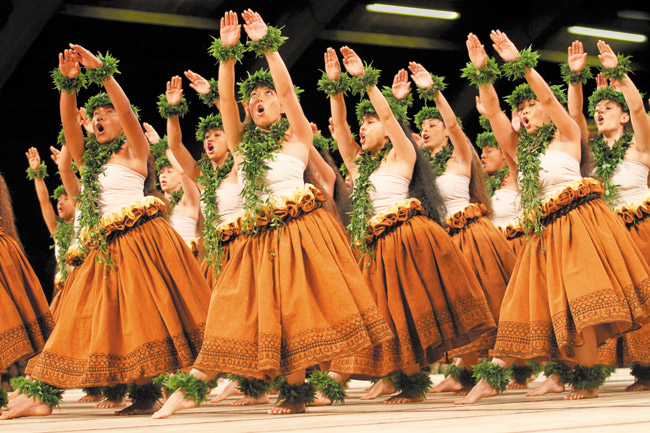 The wahine of Halau Ka Lei Mokihana O Leina‘ala dance in the kahiko portion of last year's Merrie Monarch Festival DENNIS ODA / STAR-ADVERTISER PHOTO