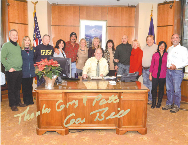 Newly elected Alaska Gov. Bill Walker (seated) is surrounded by former Kailua High School cheerleaders, who all endured the inaugural chill to support fellow cheerleader Donna (Pyle) Walker (behind the governor) as the 49th state's first lady. All the women are 1972 KHS graduates. They and their spouses are (from left) Mike and Patti (Goldbeck) Kranish, Miles and Debbie (Gee) Whitty, Greg and Patti (Wren) Culver, Debie (Izaquirre) and Brian Brillhante, Belinda (Dunn) and Greg Maggass, and Marla (Caires) and Dickie McManus. Photo from Patti Culver.