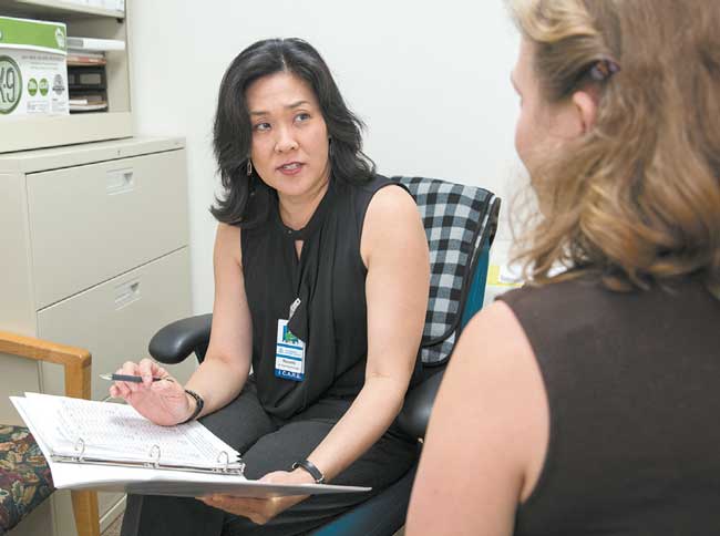Dr. Ronelle Sato counsels a patient on depression and obesity PHOTO BY ANTHONY CONSILLIO