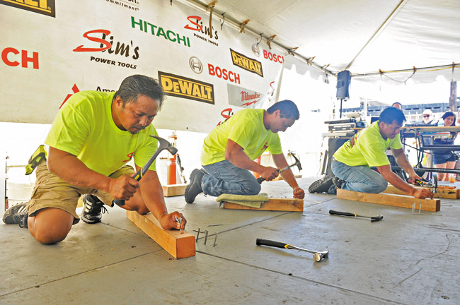 Gilbert Gambalan, Denis Valente and Joel Alverio competing in ‘Hammer Da Nail'. Photo by Lawrence Tabudlo