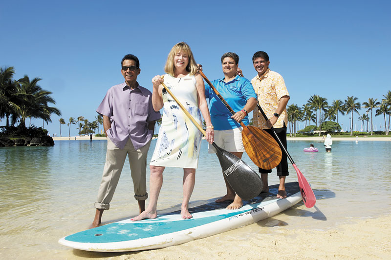 Pictured from left: Jeff Apaka of WCC, Hilton Hawaiian Village managing director Debi Bishop, Luana Froiseth of Oahu Hawaiian Canoe Racing Association — this year's honoree – and Hilton Grand Vacations general manager Henry Perez. The Challenge happens April 24.