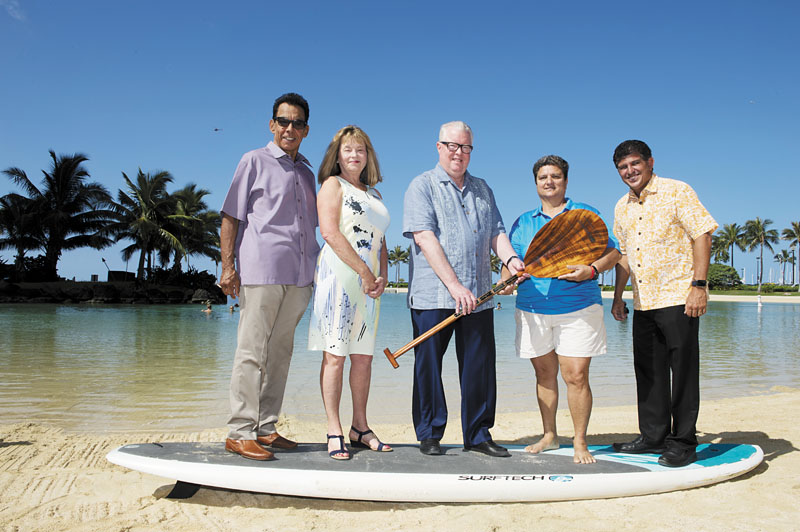 (from left) Waikiki Community Center community relations director Jeff Apaka, Hilton Hawaiian Village Waikiki Beach Resort managing director Debi Bishop, Hilton Worldwide area vice president Jerry Gibson, Luana Froiseth of OHCRA, and Hilton Grand Vacations at Hilton Hawaiian Village general manager Henry Perez