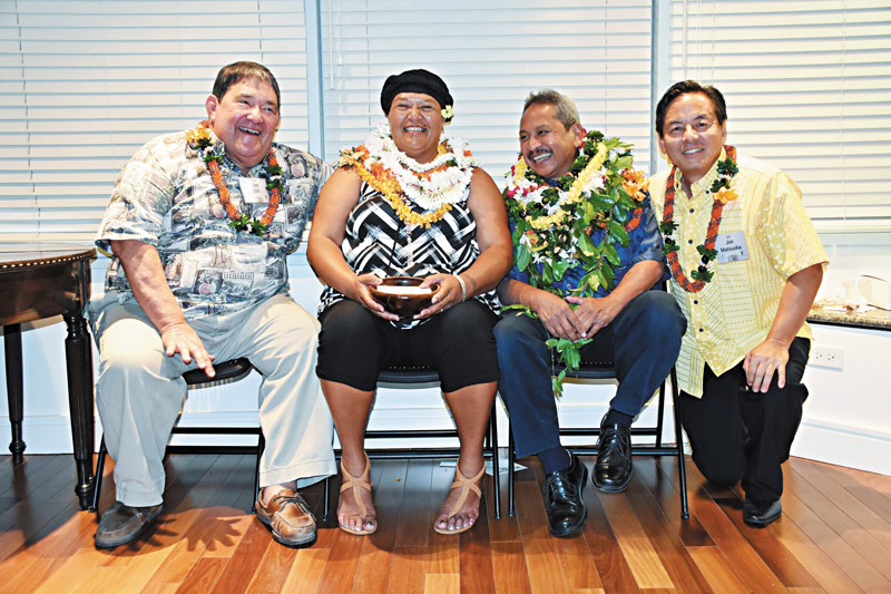 Sweets Wright and Bob Agres are congratulated by (far left) Jan Dill, founder of Partners In Development, and (far right) Jon Matsuoka, CEO of the Consuelo Foundation CONSUELO FOUNDATION PHOTO